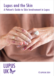 The cover of the updated Lupus and the Skin booklet. The subtitle is "A patient's guide to skin invovlement in lupus" and the picture shows a white woman's hands with a rash and some cream she rubbing in.