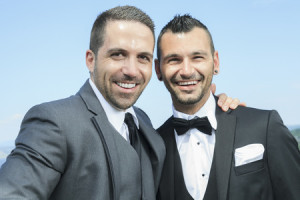 36946588 - portrait of a loving gay male couple on their wedding day.